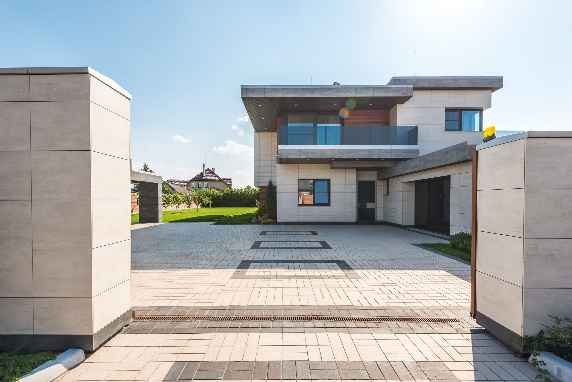 A modern detached house with a freshly cleaned paved driveway